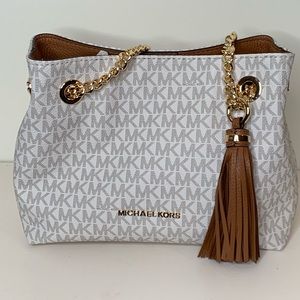 Michael Kors white/tan purse with tags.